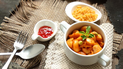 Homemade Macaroni in a white bowl on a wooden background