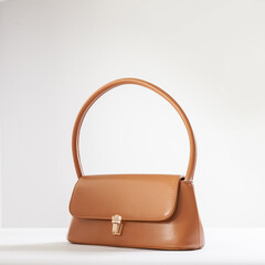Beautiful brown leather female fashion bag isolated on white background