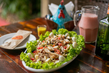 Delicious Food Contemporary Classic Dish Plate Menu Lunch Dinner Chicken BBQ Pork Sausage Bacon Regional Native Dessert on a WoodenTable