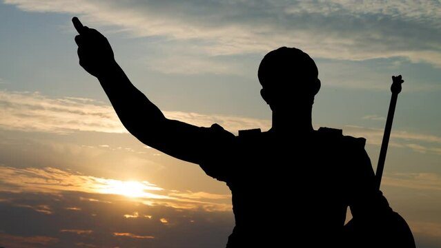 Roman emperor Julius Caesar statue. Time Lapse at Sunrise with Colorful Clouds