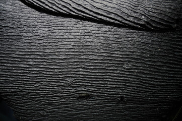 One of the first stages of production of rubber products at the plant. Close-up of raw material seam texture. Medium wholesale manufacturing technology