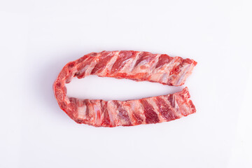 Pork ribs. Raw meat on a white background