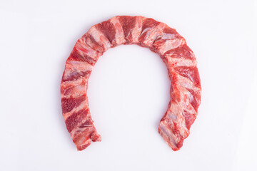Pork ribs. Raw meat on a white background