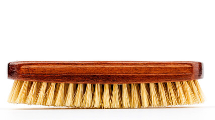Horsehair brush for polishing leather shoes, on a white background.