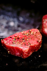 Raw tuna steak on the grill.top view. selective focus