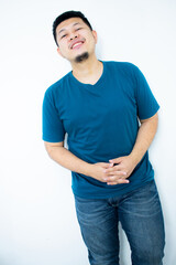 Asian young man wearing a dark green shirt smiling and looking at the camera in the white background