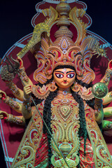 Goddess Durga idol , Durga Puja festival at night. Shot under colored light at Howrah, West Bengal,...