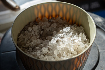 rock salt crystals in a bucket are ready for a close up