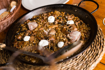 delicious Catalan mountain rice with mushrooms and pork feet