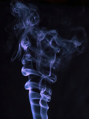 Close up movement of colorful smoke isolated on black background.Abstract background smoke curves and wave on black background.