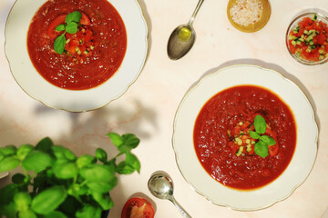 Plates with traditional gazpacho tomato soup
