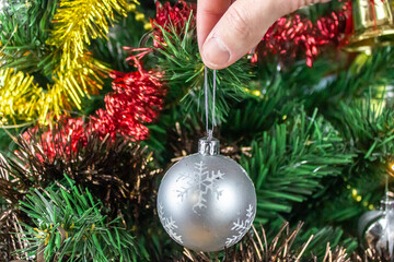 Christmas tree toy in hand, to hang on christmas tree