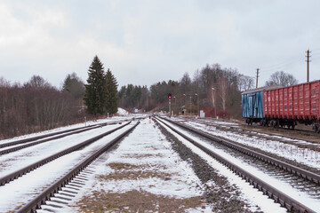 Railroad tracks in winter with a train