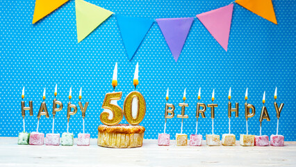 Congratulations on your birthday from the letters of candles number 50 on a blue background with...