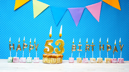 Congratulations on your birthday from the letters of candles number 53 on a blue background with...