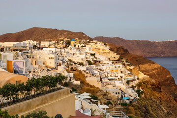 Fototapeta premium Santorini island holidays in Greece travel traveling Oia town Mediterranean Sea evening Santorin