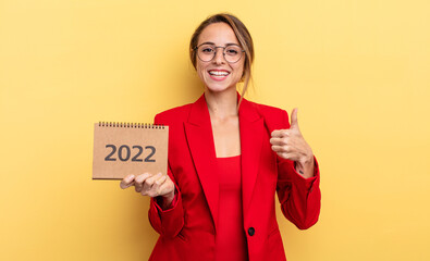 pretty young woman holding a 2022 calendar