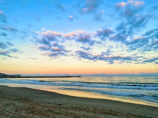 Beach scene: Seascape at sunset.