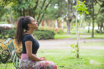 Young woman enjoying the outdoors in the park.