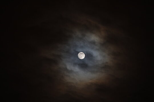 Full moon and clouds in the night sky
