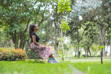 Young woman enjoying the outdoors in the park.