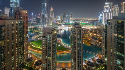 Fototapeta na wymiar Dubai Downtown cityscape with tallest skyscrapers around aerial all night timelapse.