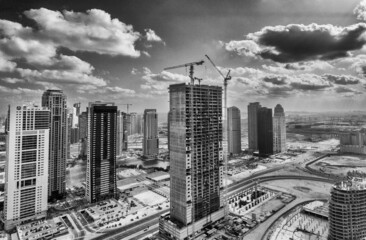 Dubai Marina from drone. Amazing city center skyline with luxury skyscrapers on a sunny day, United Arab Emirates.