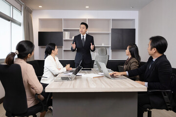 Group of Asian Business Team Having a Meeting in an Office Meeting Room