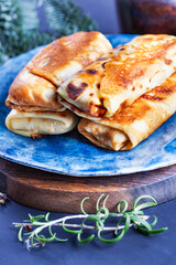 Homemade russian pancakes with meat closeup. Closeup restaurant serving of traditional maslenitsa meal.