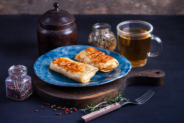 Homemade russian pancakes with meat closeup. Closeup restaurant serving of traditional maslenitsa meal.