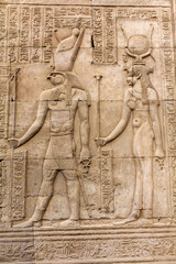 Ancient relief of two Egyptian gods at the wall of Kom Oombo temple