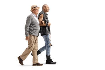 Full length profile shot of a punk holding an elderly man under arm and walking