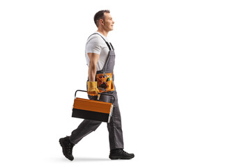 Repairman walking with a tool box