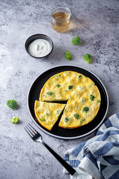 Broccoli Frittata in a plate with sauce