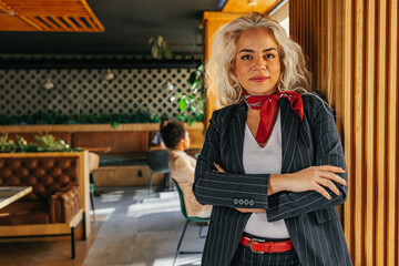 Portrait of middle age businesswoman at cafe