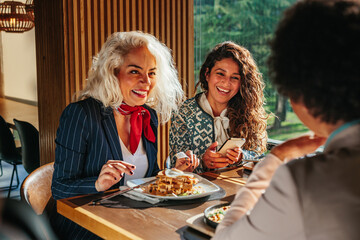 Female friends having a great time in restaurant