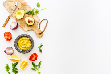 Homemade guacamole avocado dip with tomatoes and lime
