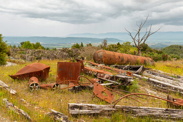Scrap in the landscape of an old mining factory in the ghost town of Waiuta, New Zealand