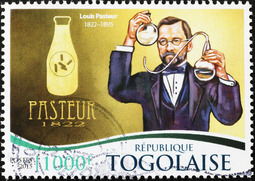 Louis Pasteur and a bottle of milk on postage stamp