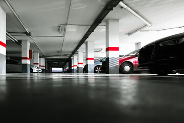 Old car park in a building on the ground floor, with natural sunlight.