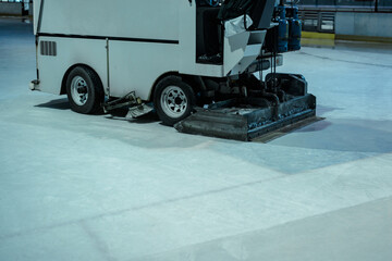 Ice resurface machine polishing the surface of the ice rink