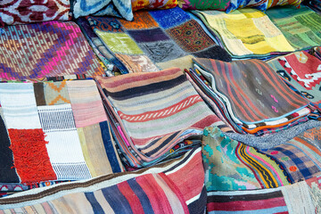 Colorful fabrics in a city market.