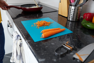 Peeled carrots on a plastic board