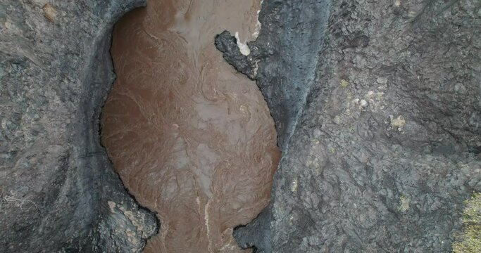 Dark river in the Payunia reserve. Nature reserve located in the province of Mendoza, Argentina.
