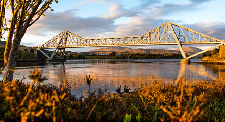 Connel Bridge, Oban, Scotland - Sunset at Connel Bridge with autumnal colours and reflections.