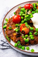 Chickpea pancakes with green peas. Vegetarian superfood, healthy brunch idea