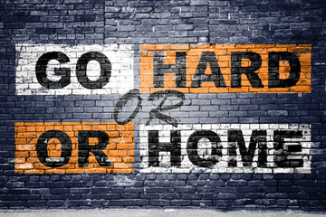Go Hard or Go Home saying lettering Graffiti on Brick Wall