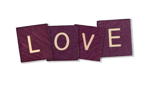 4 in 1 footage templates. animated words - Love text on purple wooden blocks. the concept of valentine's day, february 14, relationships, wedding. motion design 4K romantic animation postcard