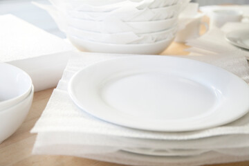Fototapeta na wymiar Packing white dishes away with white foam sheets