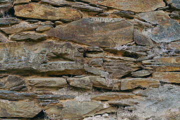 Stone wall texture with clay and spider webs.